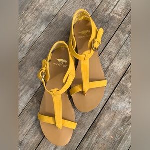 Worn but not much. Super cute mustard color sandals